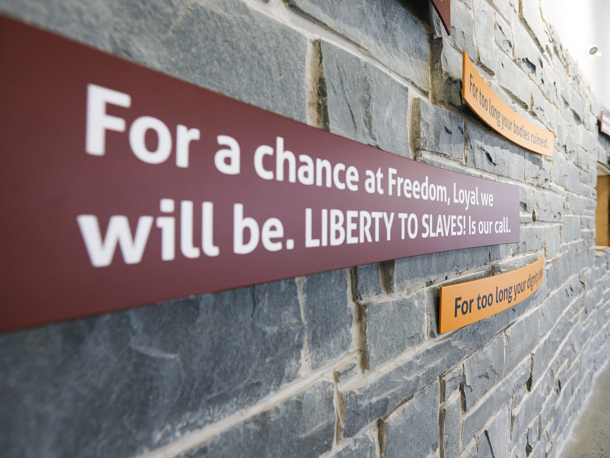 Image of the interior of the Black Loyalist Heritage Centre. Text on the wall: For a chance at Freedom, Loyal we will be. LIBERTY TO SLAVES! Is our call.