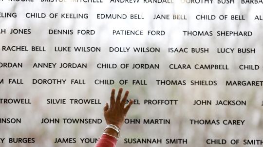 Wall of windows at the Black Loyalist Heritage Centre etched with the names of the Black Loyalists.